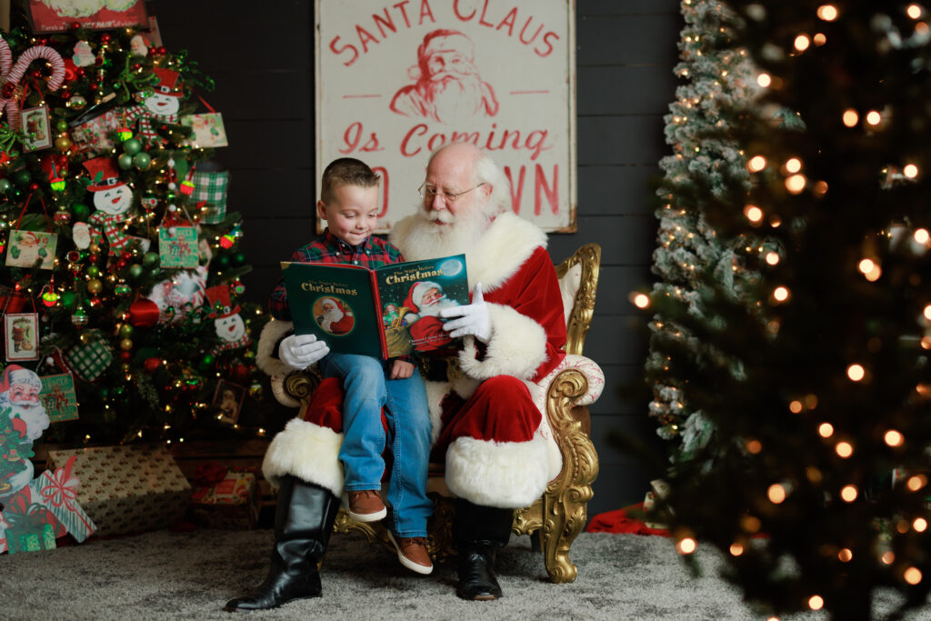 Santa reading book to kids with Christmas trees 