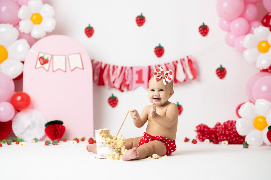 baby playing in cake