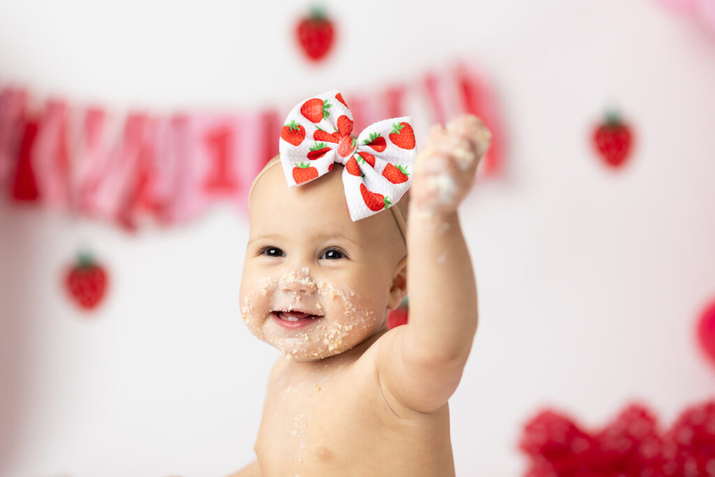 baby face covered in cake