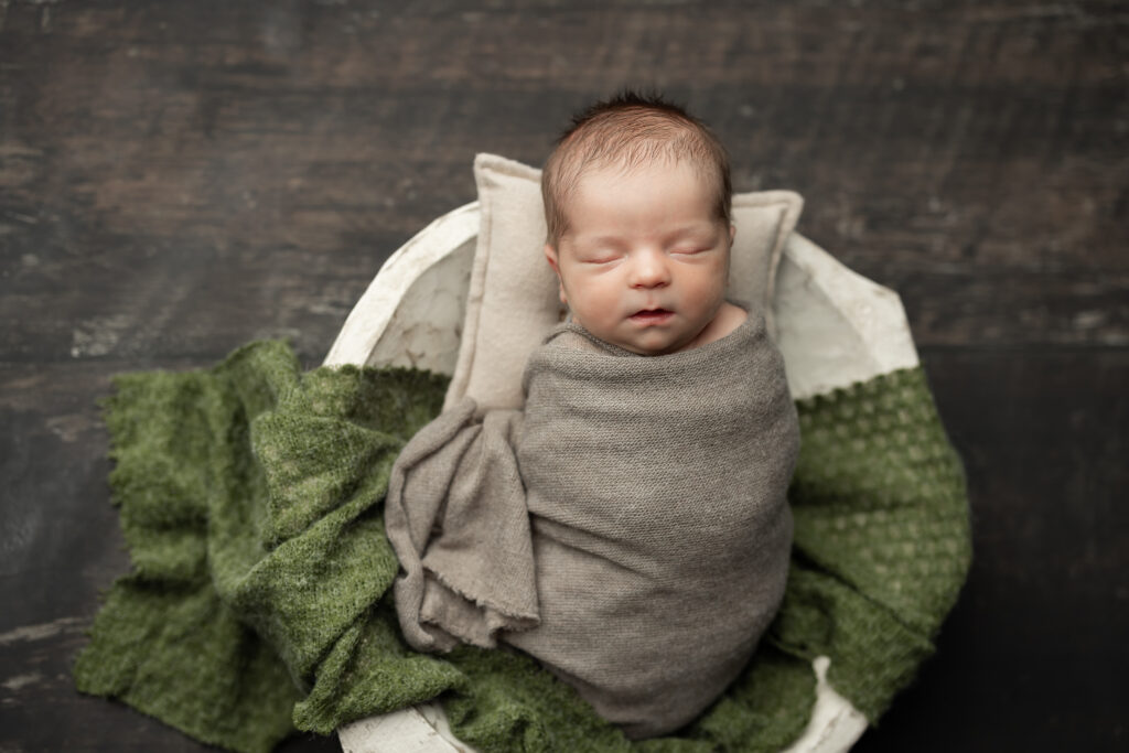 newborn boy wrapped pose bread bowl photography 