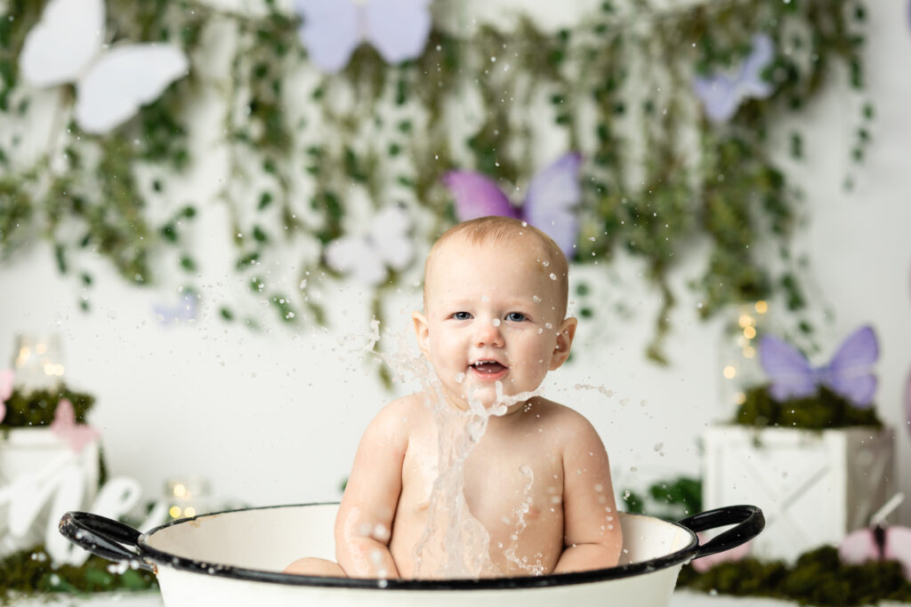 baby splashing in a bath 