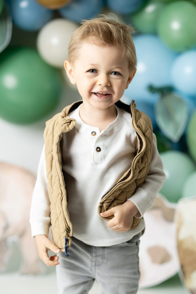 boy smiling for birthday pictures 