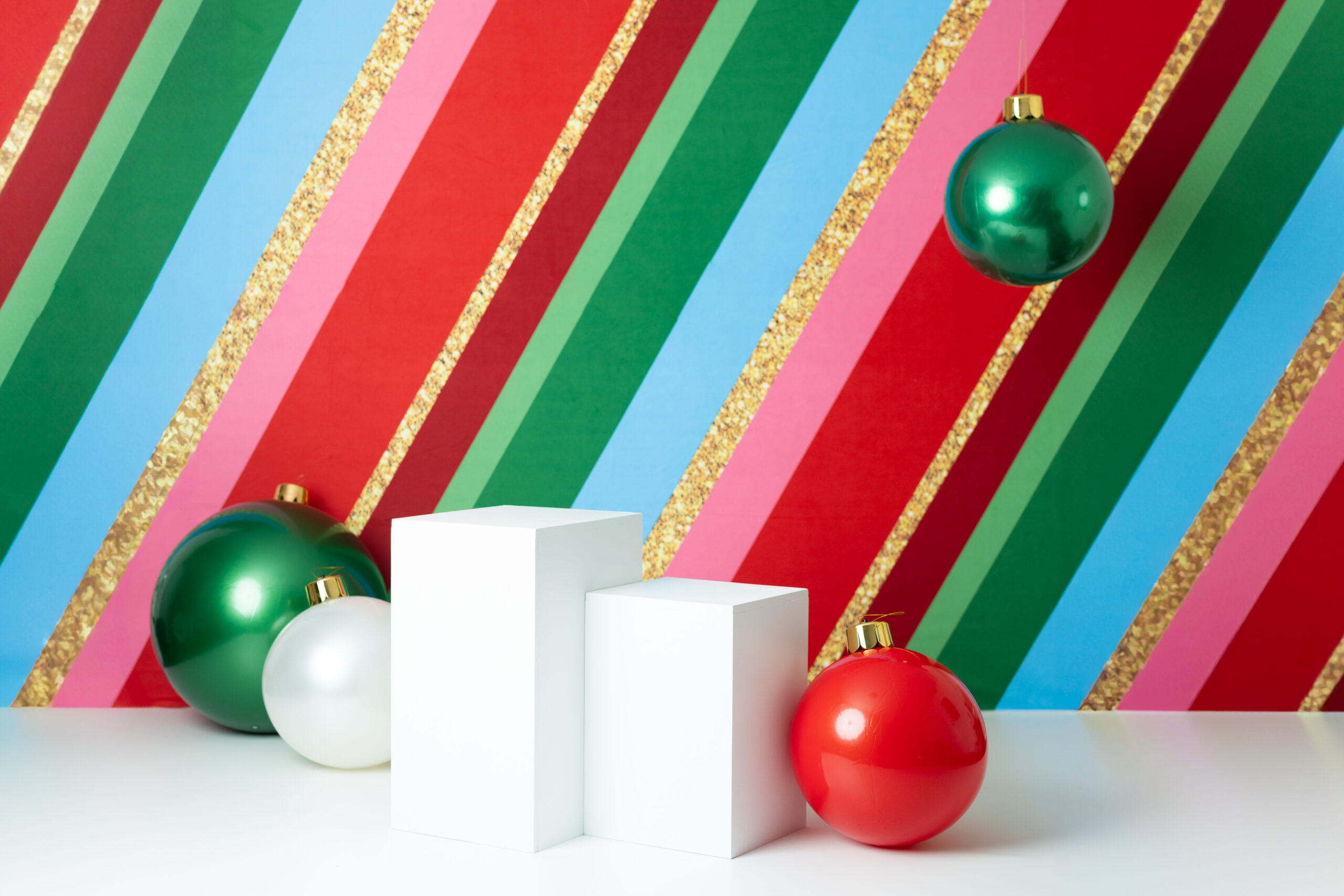 Colorful Christmas mini session setup in Canton, GA featuring bright festive decorations, holiday props, and a playful backdrop perfect for kids, siblings, and family photos.