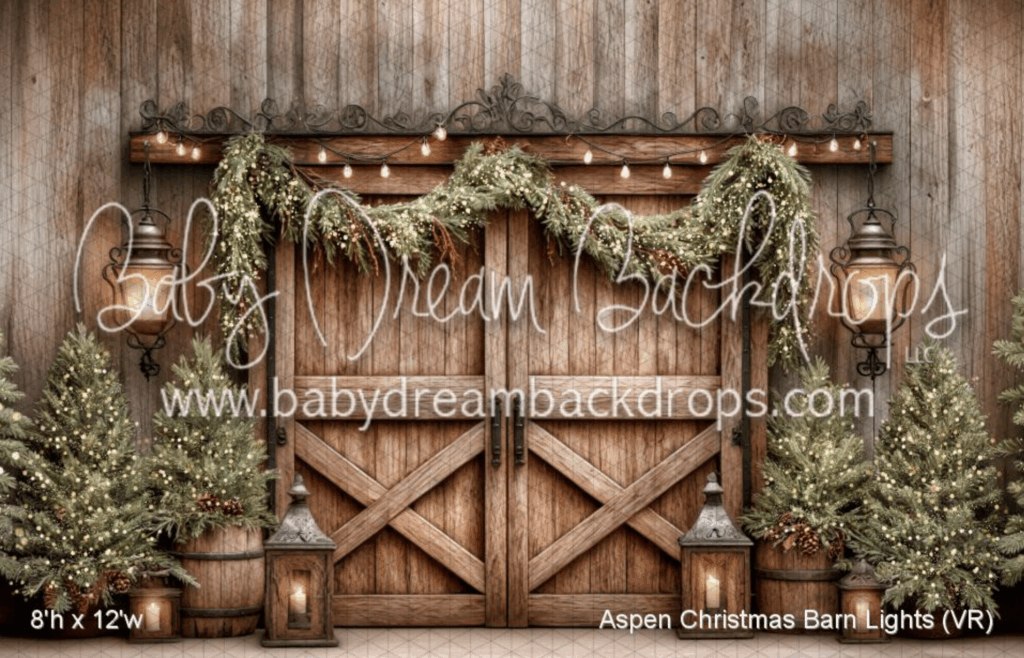 Children or family posing in an indoor rustic Aspen Christmas Barn mini-session with barn doors, pine garlands, and real trees in Canton, GA.