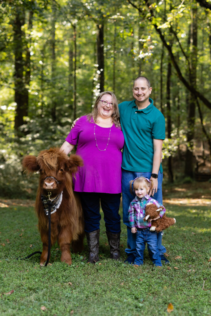Outdoor family portraits with Teddy the cow in North Georgia