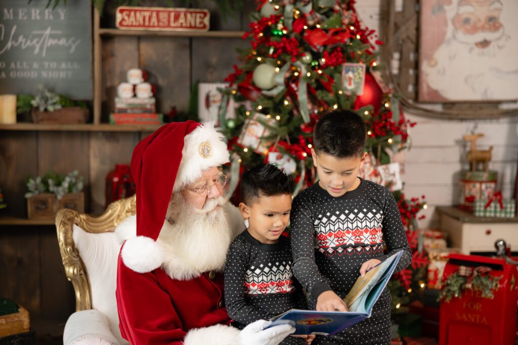 Santa greeting child by name during Christmas photo session in Canton GA