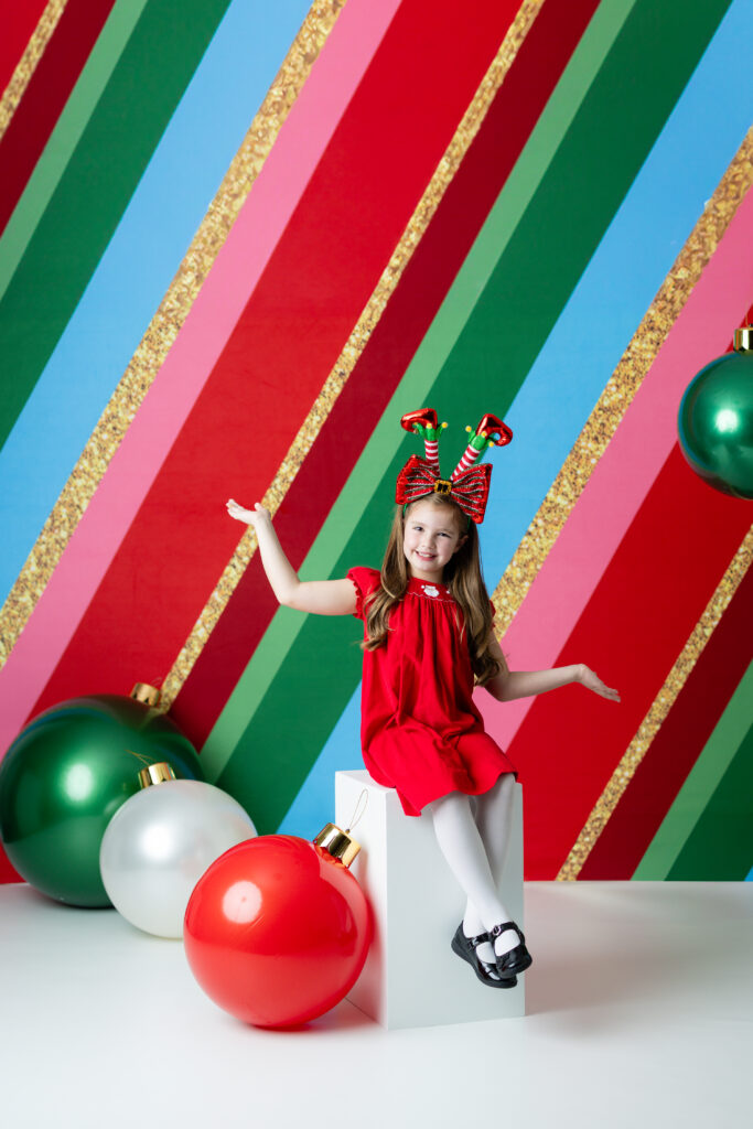 Christmas portraits in bright festive studio setup