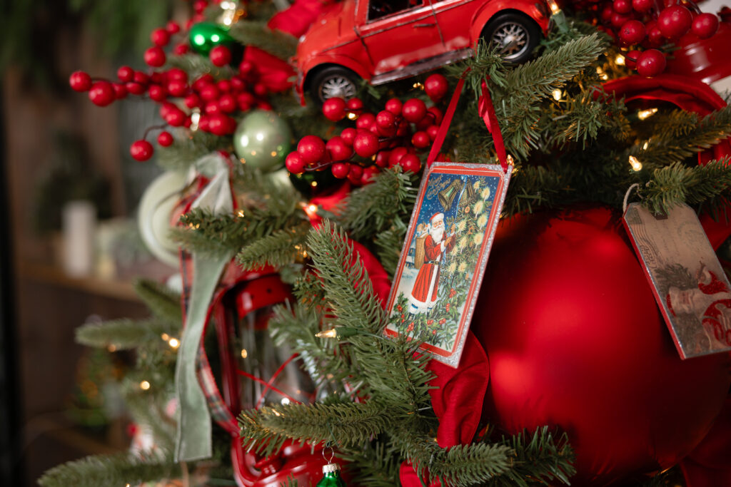 Detail shot of Christmas tree from Santa Mini Session set in Canton, GA studio — decorated with twinkle lights, ornaments, and festive holiday décor.
