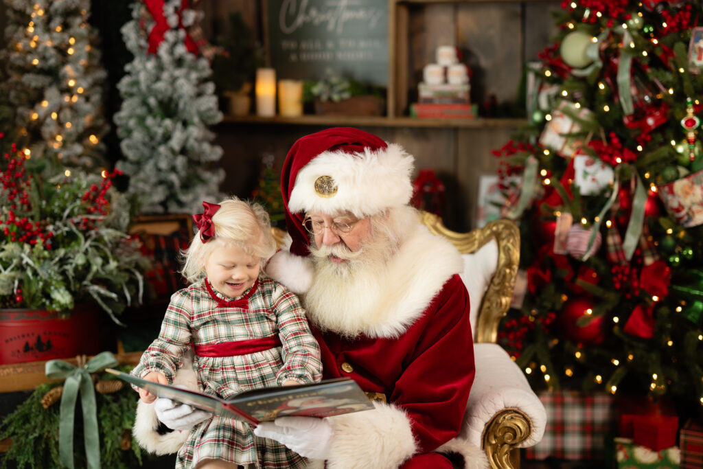 Girl sharing smiles with Santa during festive photo session