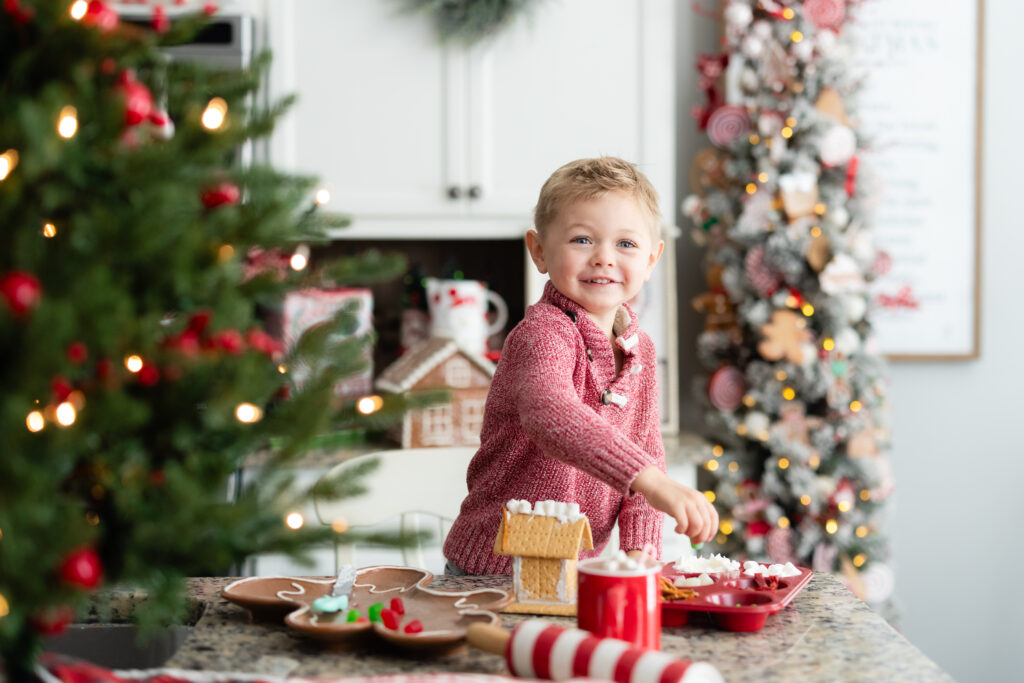 Kids throwing marshmallows in Christmas baking mini session in Canton GA studio