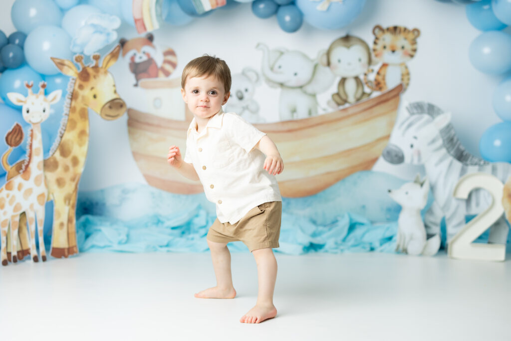 Playful twin birthday portraits Noah’s Ark theme Canton GA photographer