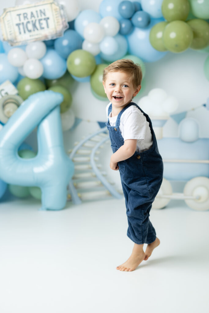 Train birthday theme with balloons and train props in Canton GA studio