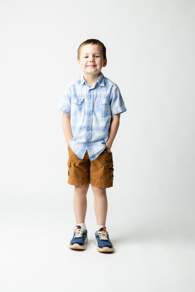 Young boy preschool portrait clean studio background North Georgia school photographer
