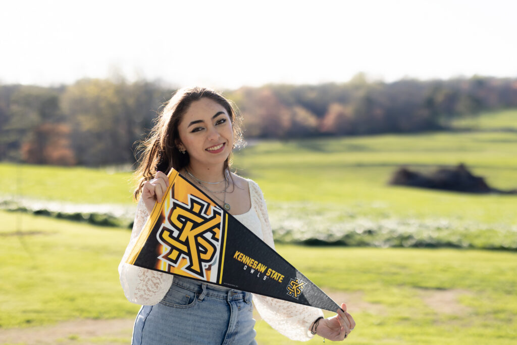 High school senior holding Kennesaw State University pennant Canton GA
