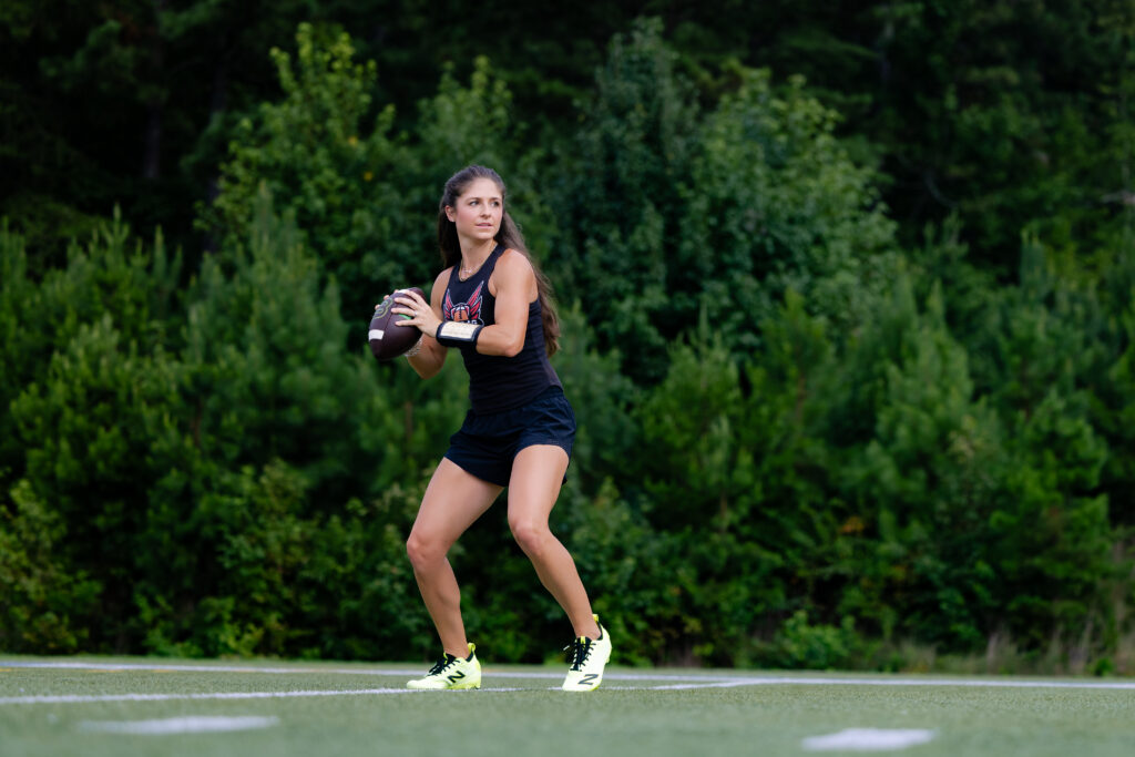 Coach Dakota running during a flag football action photography session